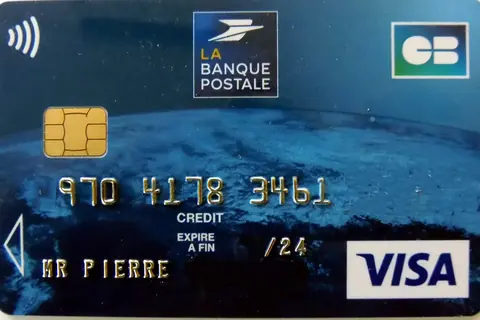 Close-up of a Visa debit card with its chip and contactless symbol