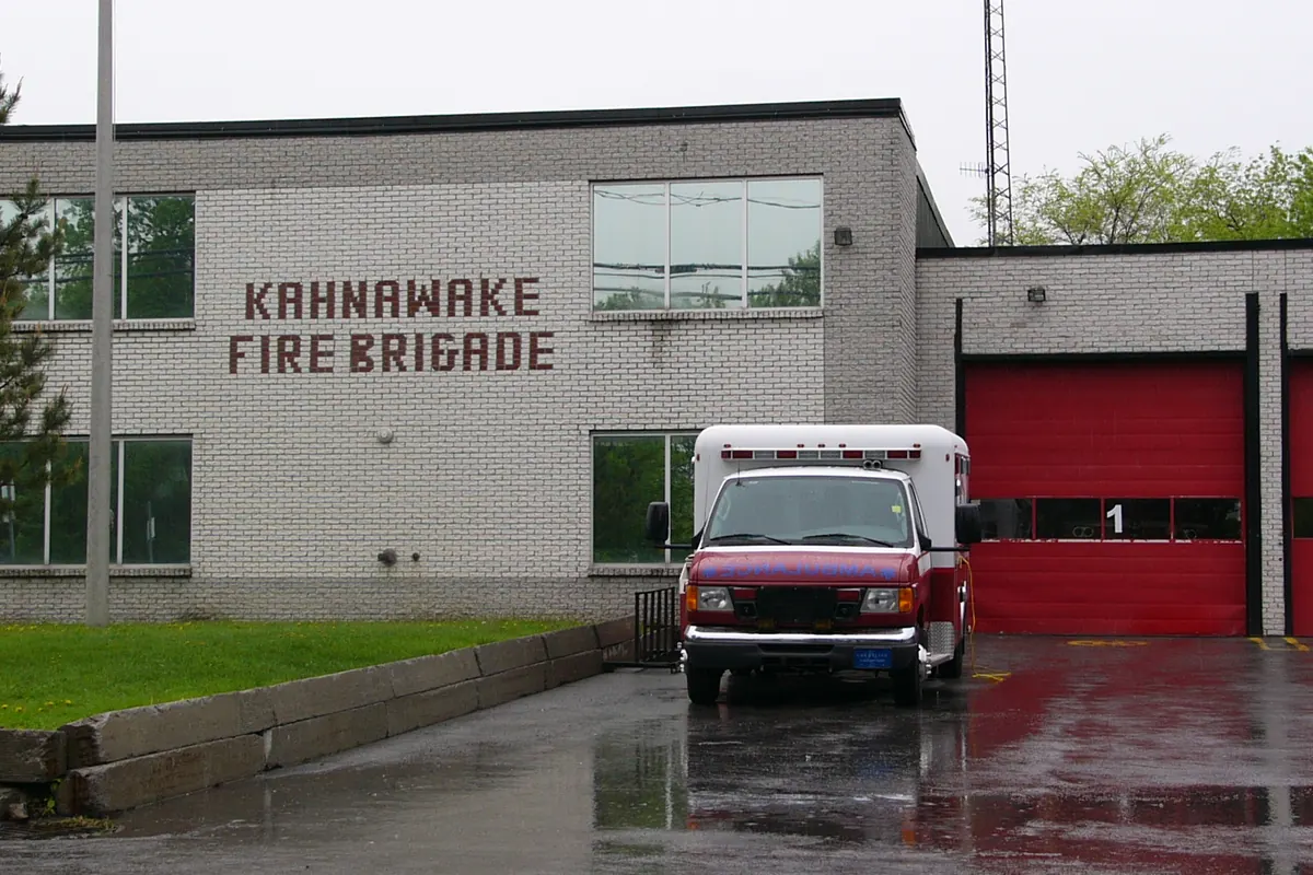Kahnawake fire brigade station with a fire truck at the open bay