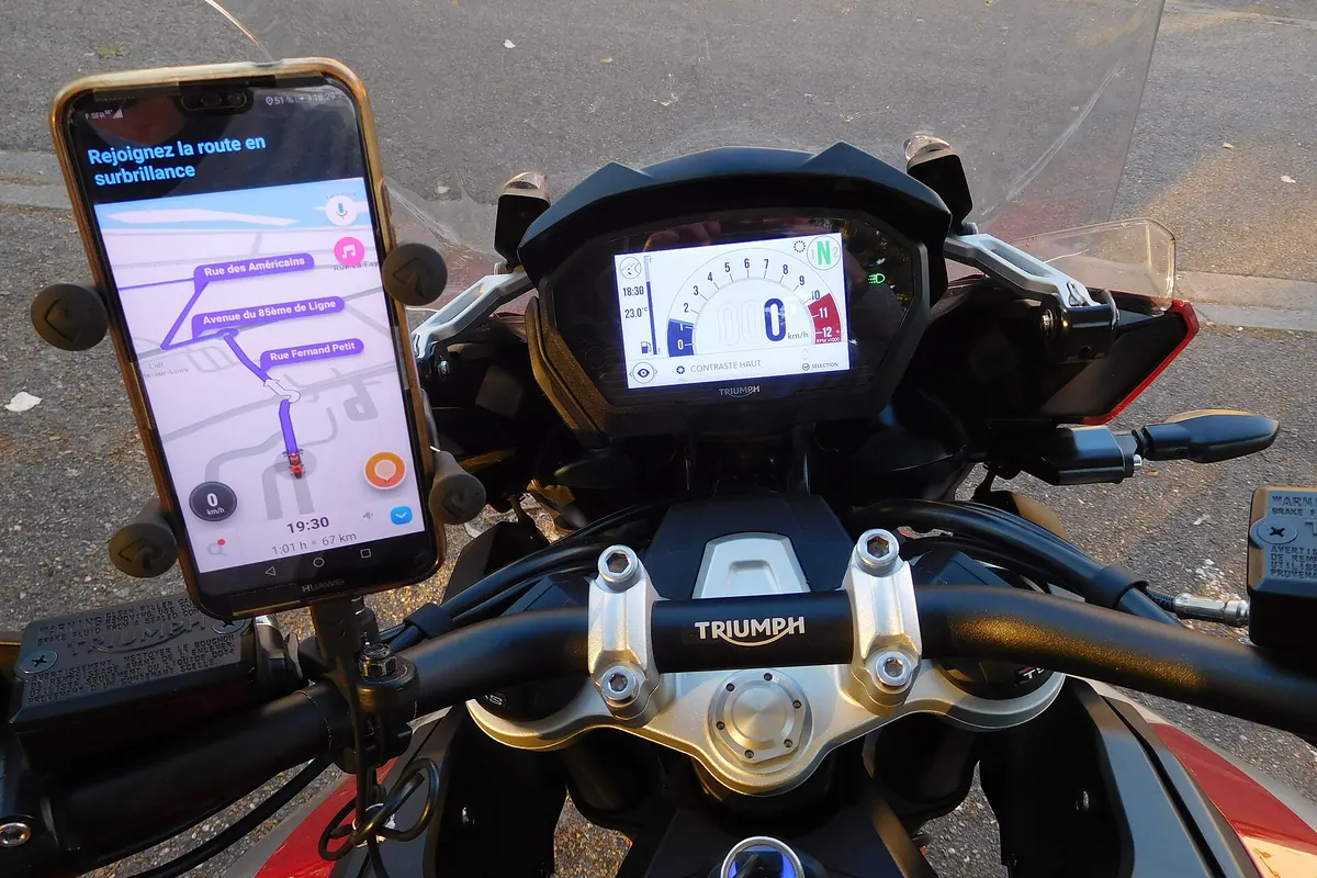 Phone with a navigation map mounted on motorcycle handlebars
