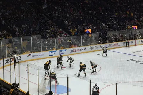NHL All-Star Game face-off seen from the stands of a full arena